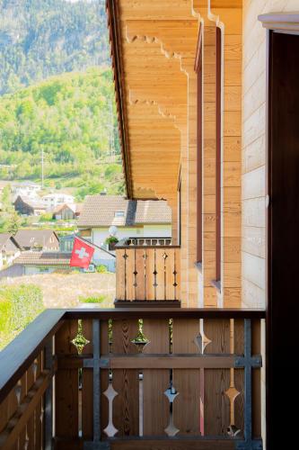 a balcony with a view of a mountain at Doodle's Amazing Chalet -Walensee - Flumserberg - Churfirsten - Heidiland - Pool - Sauna in Mols