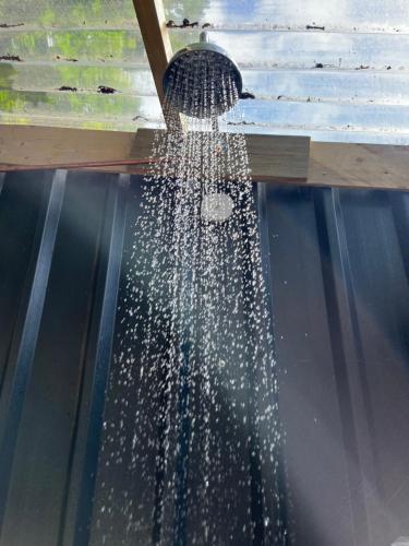 a stream of water is coming out of a window at The Toad's pad in Tiverton