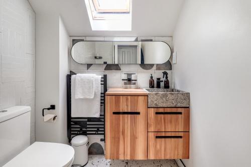 a small bathroom with a sink and a toilet at Pass the Keys Perfectly presented house in Sevenoaks