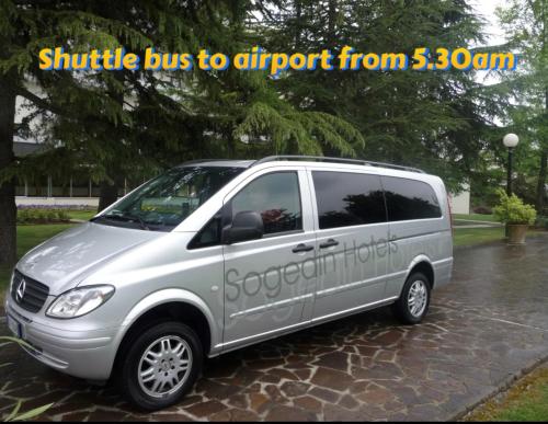 a silver van parked in a driveway in the rain at Antony Hotel - Venice Airport in Campalto