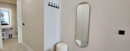 a mirror on the wall of a bathroom at MD Pare Presentat in Valencia