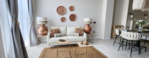 a living room with a white couch and a table at MD Pare Presentat in Valencia