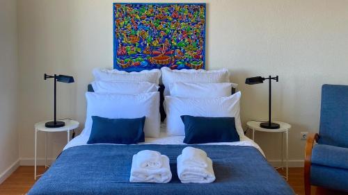Katil atau katil-katil dalam bilik di Casa ideal para famílias com vista mar desafogada