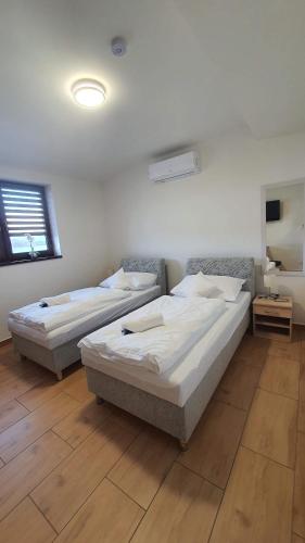 Säng eller sängar i ett rum på Ski & Wake Resort Těrlicko