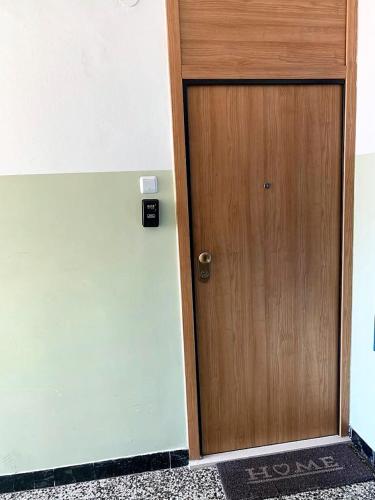 a wooden door in a room with a wall at MM Split apartment - 5 min by car to the beach & city center - free public parking in Split