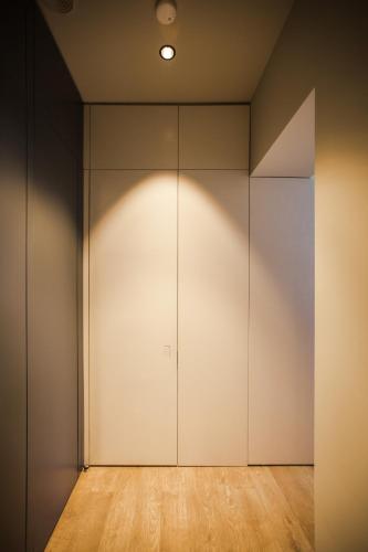 an empty room with a large white closet at Luxury studio with a park view in Rīga