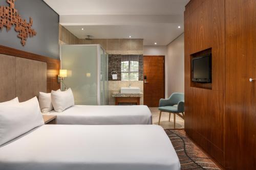 Katil atau katil-katil dalam bilik di Protea Hotel by Marriott Clarens