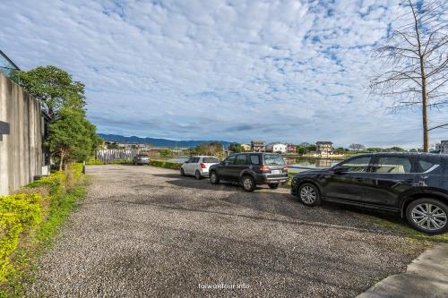 a group of cars parked on the side of a road at Villa Le Ballon Bleu in Wujie