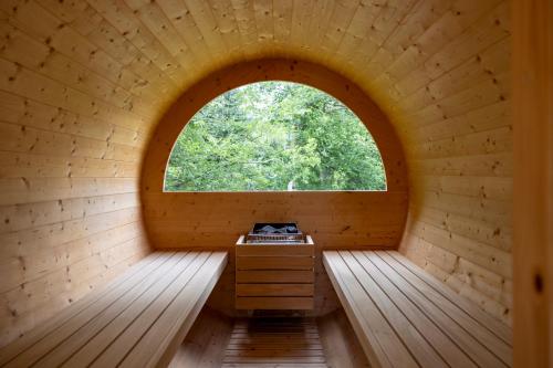 an inside view of a sauna with a window at Hotel Derby in Folgarida
