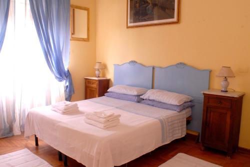 Postel nebo postele na pokoji v ubytování Villa Fiorita
