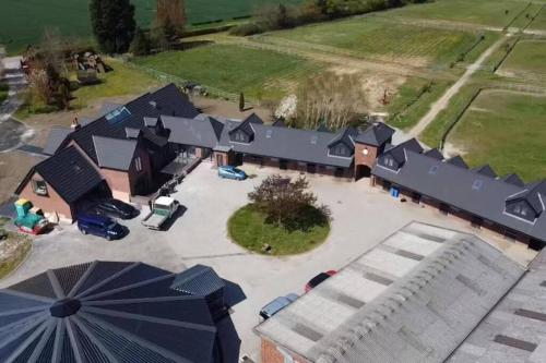 an overhead view of a house with an umbrella at Appaloosa suite with amazing views of stud farm. in Great Driffield