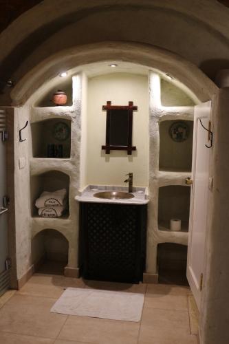 a bathroom with a sink in the middle of a room at Artika Wadi Kiki Hotel in Aswan