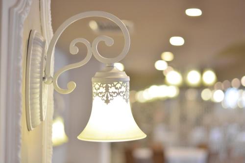 a bell hanging on a door in a restaurant at Boutique Hotel Argo in Kutaisi