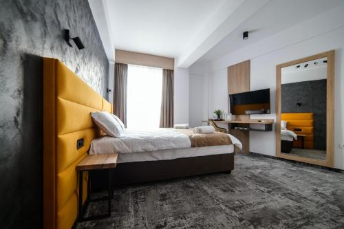 Ένα ή περισσότερα κρεβάτια σε δωμάτιο στο GBU Home Timisoara