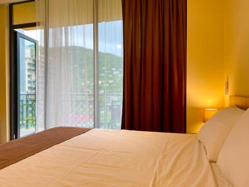 Postel nebo postele na pokoji v ubytování Scorpio Hotel Gonio