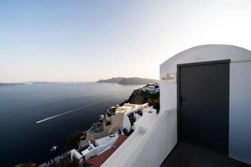 a view of the ocean from the side of a building at Bligos Villas in Oia