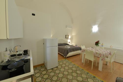 Una cama o camas en una habitación de L'Antico Palazzo