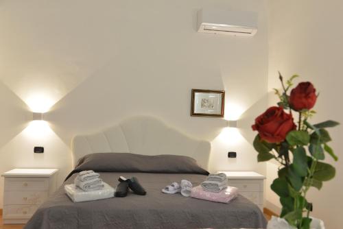 Una cama o camas en una habitación de L'Antico Palazzo