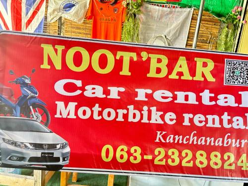 a sign for a not bar car rental motorcycle rental at Noot's Guesthouse in Kanchanaburi