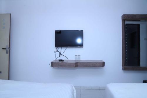 Ein Bett oder Betten in einem Zimmer der Unterkunft Hotel Kewal INN