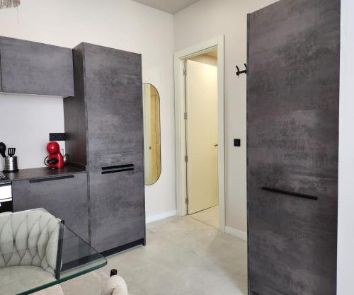 a living room with a large metal door in a room at MD Pare Presentat in Valencia