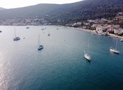 an aerial view of boats in a large body of water at Hotel Korfos - Ξενοδοχείο Κόρφος Renovated in Korfos