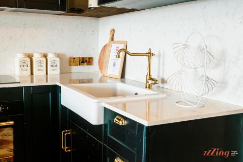 a kitchen with a sink and a counter top at A luxury apartment in Malta’s capital Valletta in Valletta