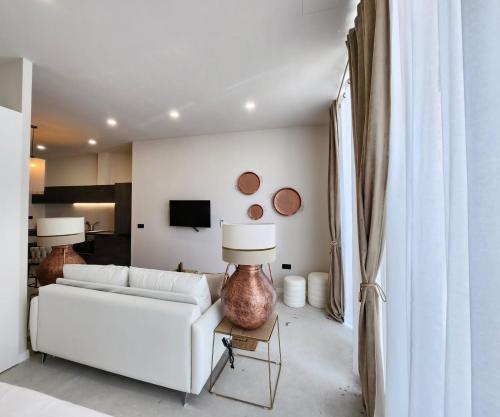 a living room with a white couch and a table at MD Pare Presentat in Valencia