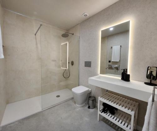 a bathroom with a shower and a toilet and a sink at MD Pare Presentat in Valencia