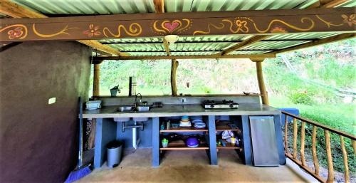 a kitchen in a house with a sink at Terra NaturaMa - off grid living in the jungle in Punta Uva
