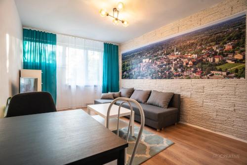 a living room with a couch and a table at SKY Apartment 2 in Oświęcim