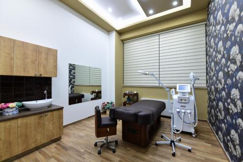 a salon with a chair and a barber shop at Hills Resort Hotel in Yerevan