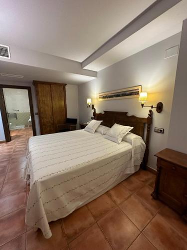 Кровать или кровати в номере Hotel Doña Manuela