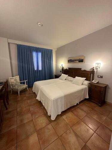 Кровать или кровати в номере Hotel Doña Manuela