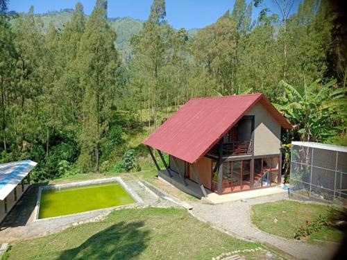 an aerial view of a house with a red roof at Istana Bromo Resort in Bromo