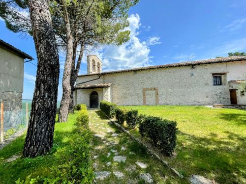 an external view of a building with trees and grass at Torretta sleeps 5 with pool and exclusive gardens plus private verandah in Strettura