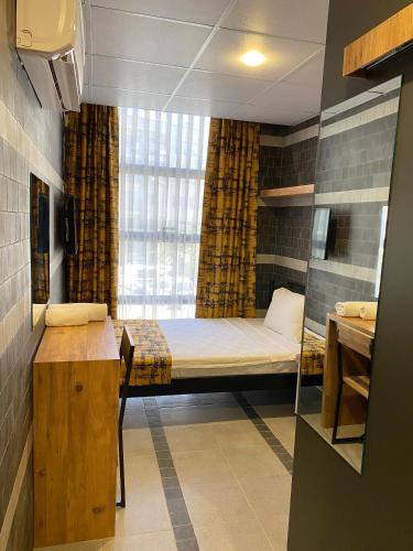 Letto o letti in una camera di M-ODA OTEL