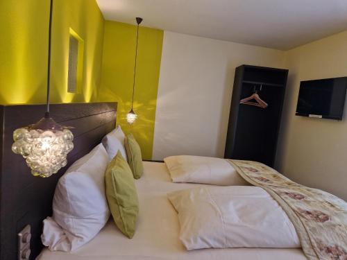 Cama o camas de una habitación en Laurentius Boutique-Hotel & Restaurant