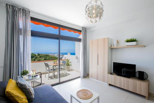 a living room with a view of the ocean at Cozy apartment with seaview and parking in Adeje