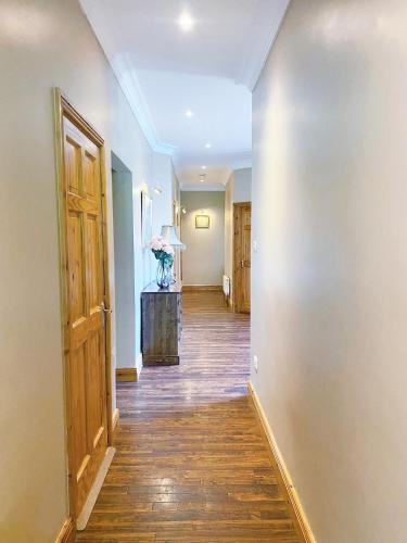 an empty hallway with a door and a room at Tour House, A Country Escape set in Natures Beauty in Youghal