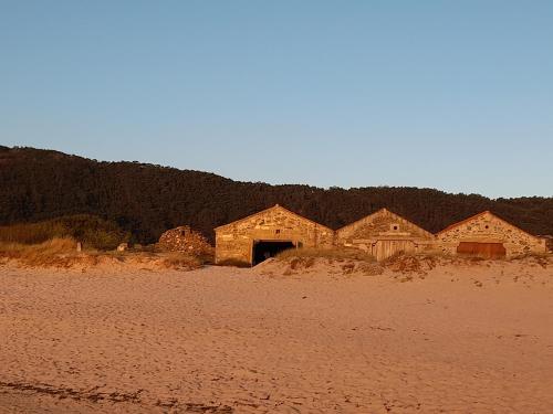 a group of old buildings in the desert at Casa da Varanda in Carreço