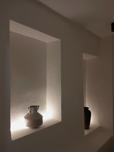 a vase sitting on a shelf in a room at Soleil boutique house with terrace in Rethymno Town