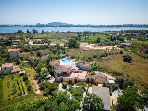 an aerial view of a large house with a pool at Hotel L'Ulivo in Girasole