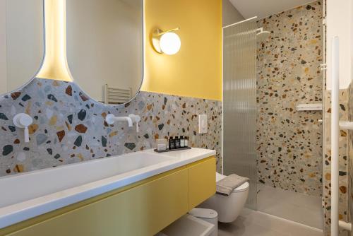 a bathroom with a sink and a mirror at Casa Navarino by Immobilis in Nafplio