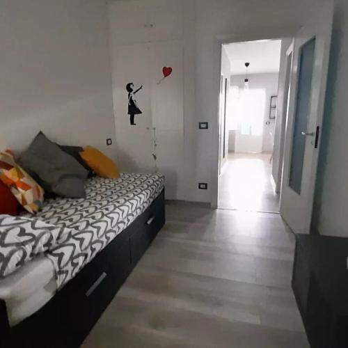 a bedroom with a bed and a room with a balloon at Peter Pan in Castellino Tanaro