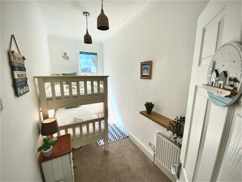 a staircase in a room with a stair case at The Beach House by Sorted Stay in Southend-on-Sea