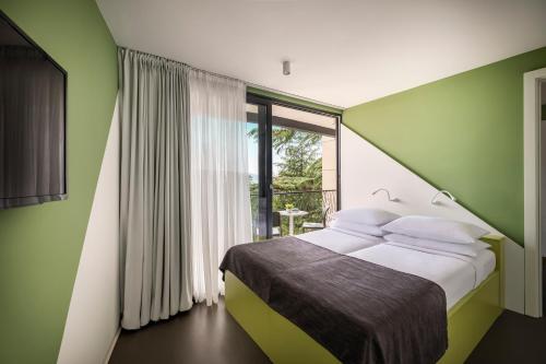Postel nebo postele na pokoji v ubytování Aminess Vival Casa Lišanj