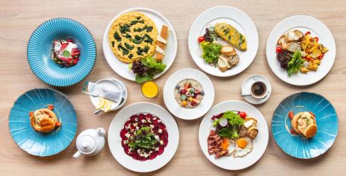 a group of plates of food on a table at Hotel Bażantowo Sport in Katowice
