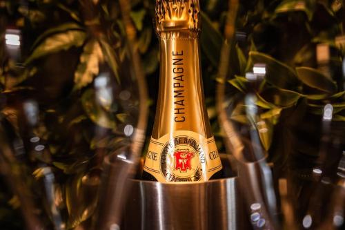 a bottle of champagne sitting on a metal container at LOFT Design Studio 600m zur Messe/Lanxess in Cologne