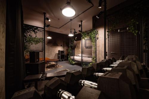 a room with a bunch of tables and plants at LOFT Design Studio 600m zur Messe/Lanxess in Cologne